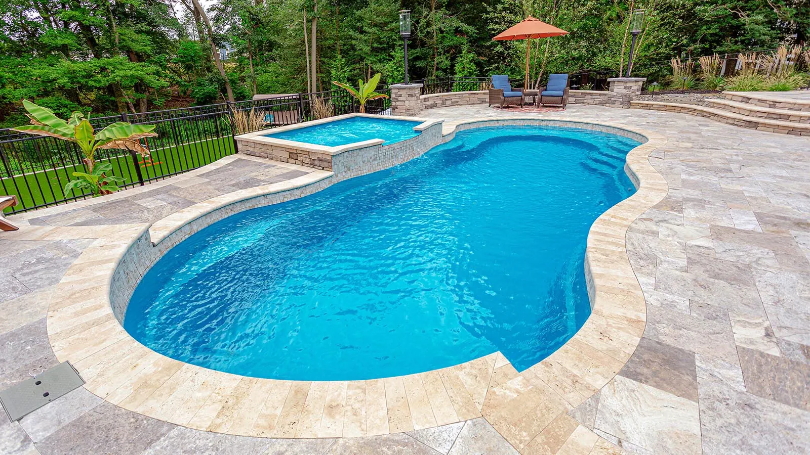 CrystalBlue_Hero A Leisure Pools inground pool with Crystal Blue color