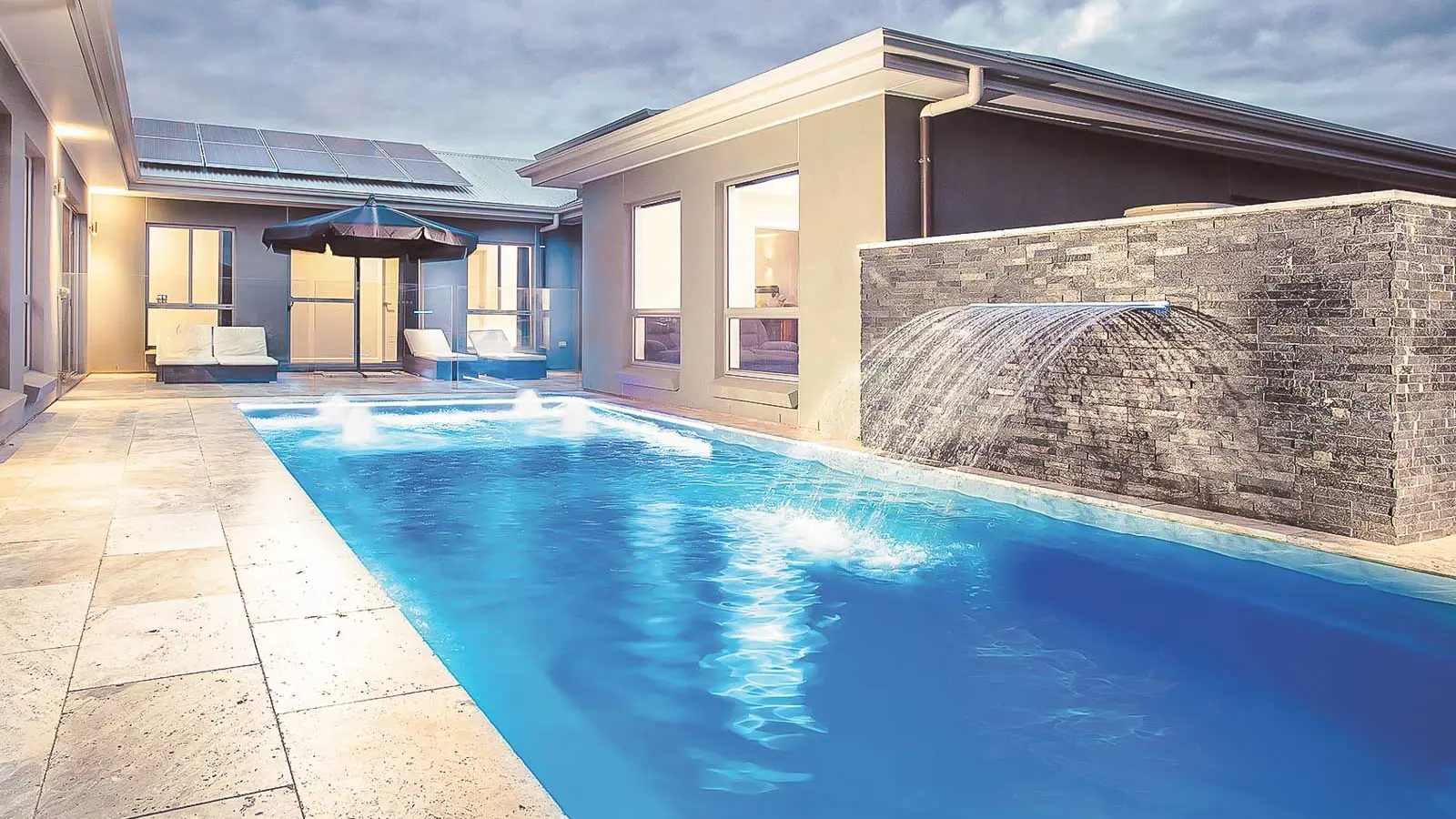 The Reflection™ including Splash Deck, a fiberglass pool design manufactured by Leisure Pools